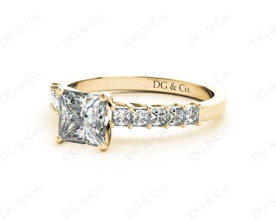 Princess Cut Four Claw Set Diamond Ring with Princess Cut Stones Down the Shoulders and Brilliant Stones on Sides. in 18K Yellow