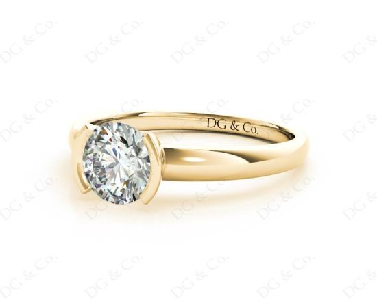 Round Cut Bezel Set Diamond Ring on a Plain Band. in 18K Yellow