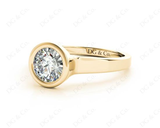 Round Cut Bezel Set Solitaire Engagement Ring With a Plain Band in 18K Yellow