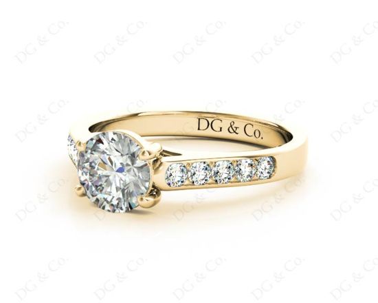 Round Cut 4 Claw Side Stone Engagement Ring with Channel Set Side Stones in 18K Yellow